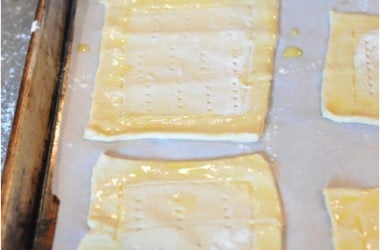 uncooked cheese danish dough on a cookie sheet