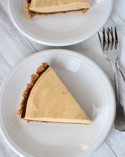 Top view of a slice of peanut butter pie on a white plate.