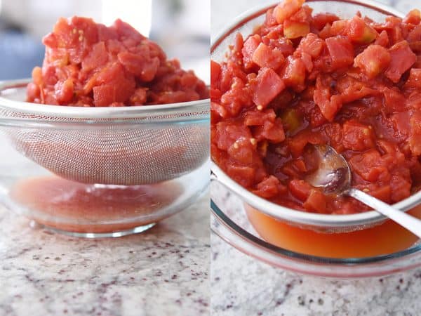 straining diced tomatoes in fine mesh strainer