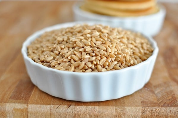 A white ramekin full of wheat berries.