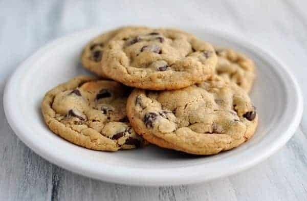 white plate full of chocolate chip cookies