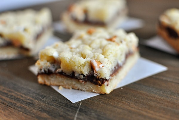 a layered Nutella crumble bar on a piece of parchment paper