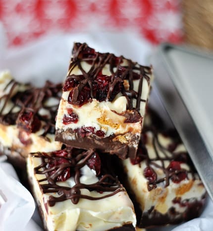 white chocolate and milk chocolate bark with drizzled chocolate and cranberries