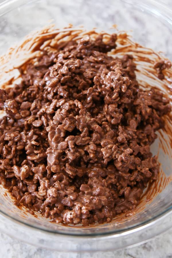 Peanut butter, chocolate and rice krispy filling in glass bowl.