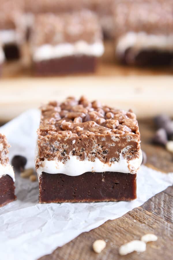 Killer crunch brownie on white piece of parchment paper.