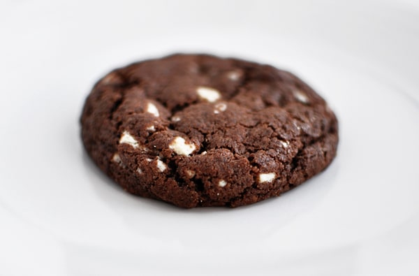 A chocolate cookie with white chocolate chunks.