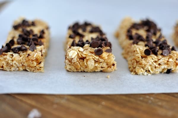 Front view of granola oat granola bars topped with chocolate chips.