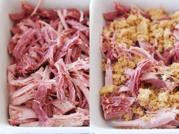 Shredded sweet baked ham in white baking dish.