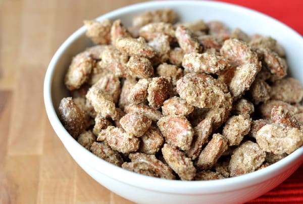 White bowl full of candied almonds.