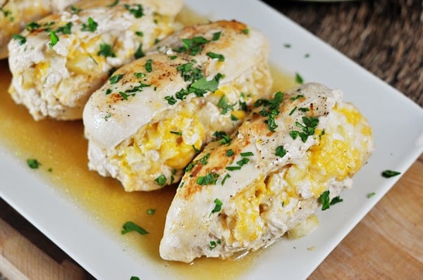 Apple Stuffed Chicken Breasts on a white platter. 