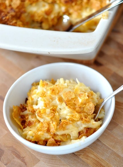 A white bowl of Cheesy Au Gratin Potatoes.