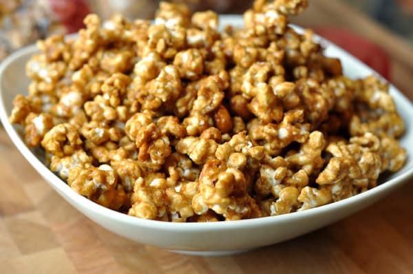 White bowl full of toffee popcorn.