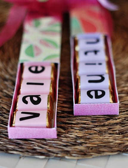 two half opened homemade chocolate Valentine's Day boxes with wrapped chocolates inside