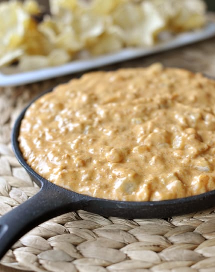 Cast iron skillet full of chorizo dip.