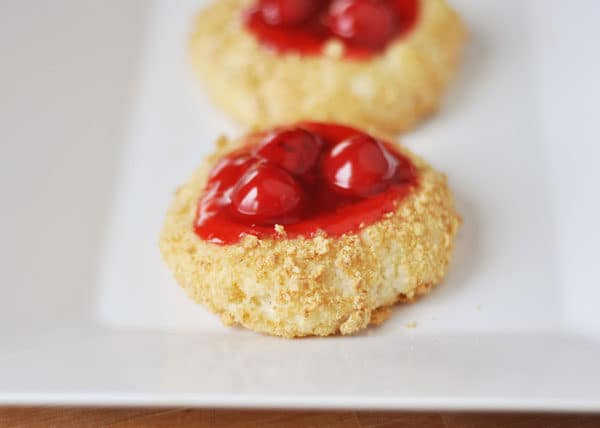 Crumb coated cheesecake cookie with a cherry center.