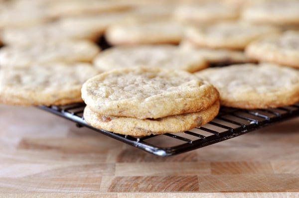 Cookies on a dark cooling rack.