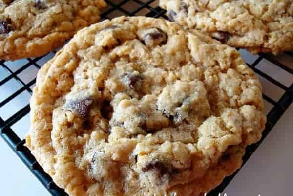 Chocolate chip cookie on a cooling rack.