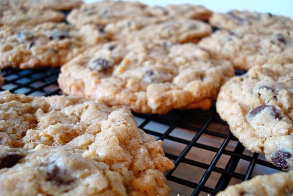 Chocolate chip cookies on a cooling rack.