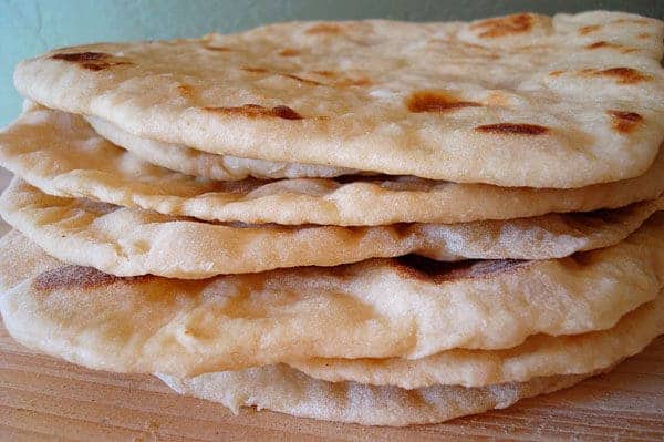 Stack of golden soft wrap bread.