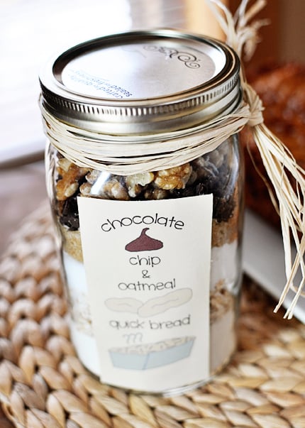 Mason jar with layered dried ingredients for oatmeal chocolate chip quick bread.