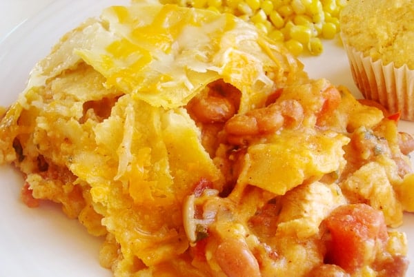 White plate with chicken tortilla casserole.