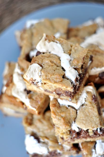 A stack of S'mores cookie bars on a blue plate.