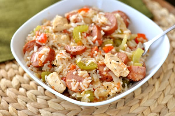 White bowl full of chicken and sausage jambalaya.