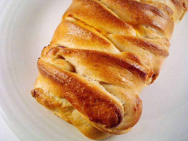 braided bread loaf on a white plate