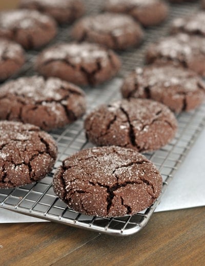 Chocolate sugar cookies on a cooling rack.