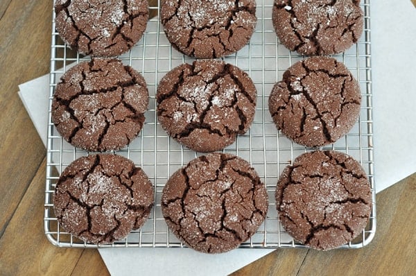 Top view of chocolate sugar cookies cooling on a cooling rack.