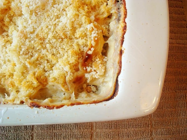 White casserole dish with chicken cordon bleu casserole.