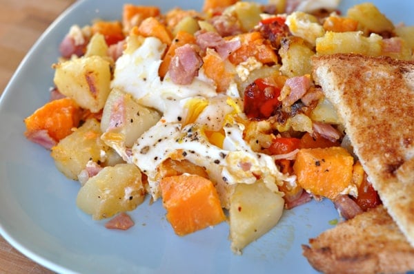 Egg and potato hash on a plate.