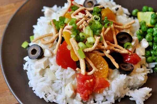 white rice with hawaiian haystack toppings on a black plate