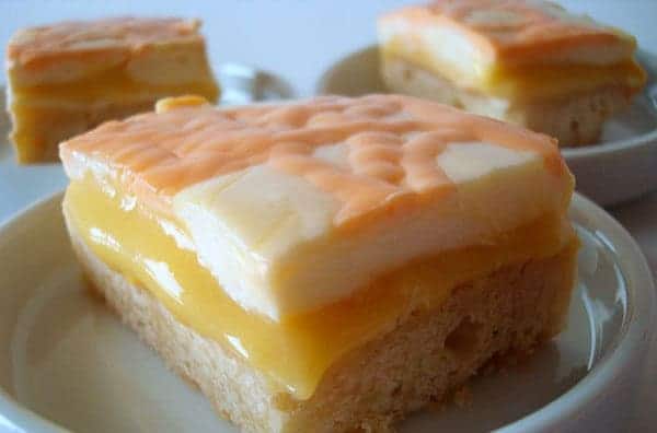 shortbread based bar with orange middle and cream top