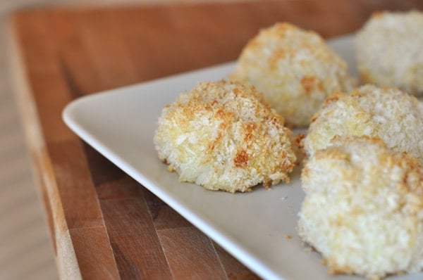 Small round potato puffs on a white plate.