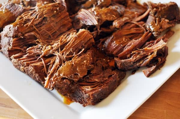 White platter with shredded sweet and spicy pot roast.