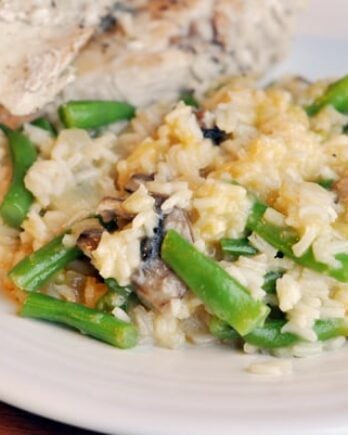 white rice and green beans, with sliced chicken on the side