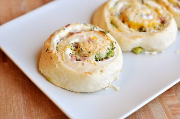 A stuffed pinwheel roll on a white plate.