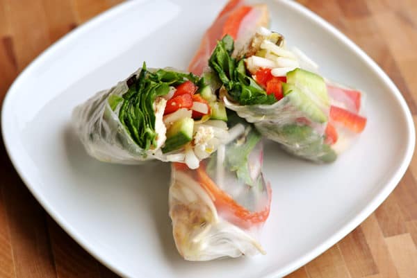 cut open spring roll on a white plate