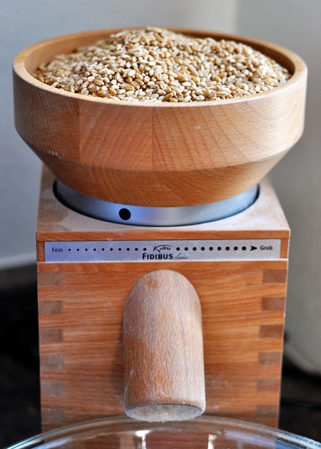 a wheat grinder full of wheat berries ready to be ground