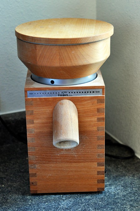 a Komo wheat grinder on a counter