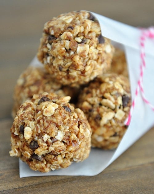 A white paper cone filled with chocolate chip granola bites.