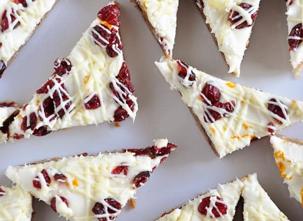 top view of white chocolate cranberry bliss bars cut into triangle shapes