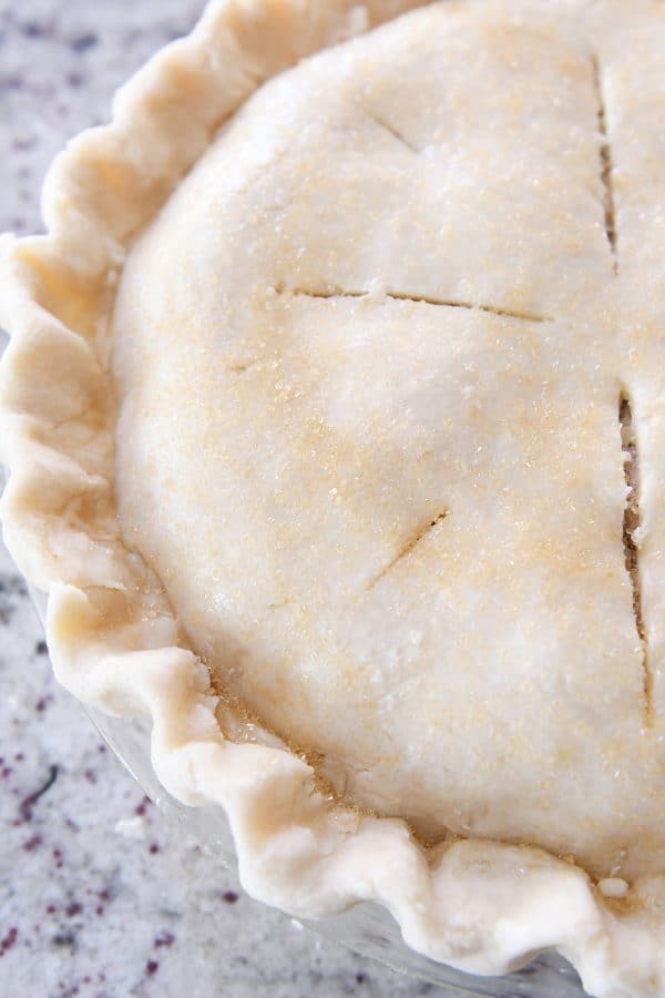 Fluted pie crust with slits on top.