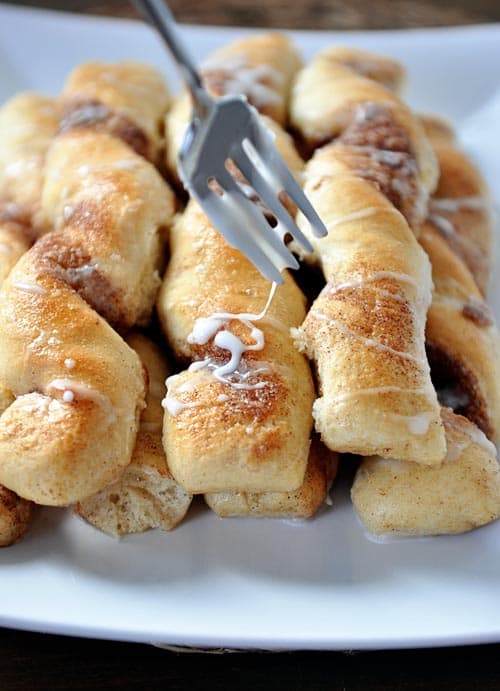 Cinnamon and sugar breadsticks with a light glaze over the top.