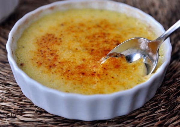 A white ramekin of creme brûlée.