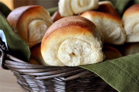 a basket of golden brown rolls