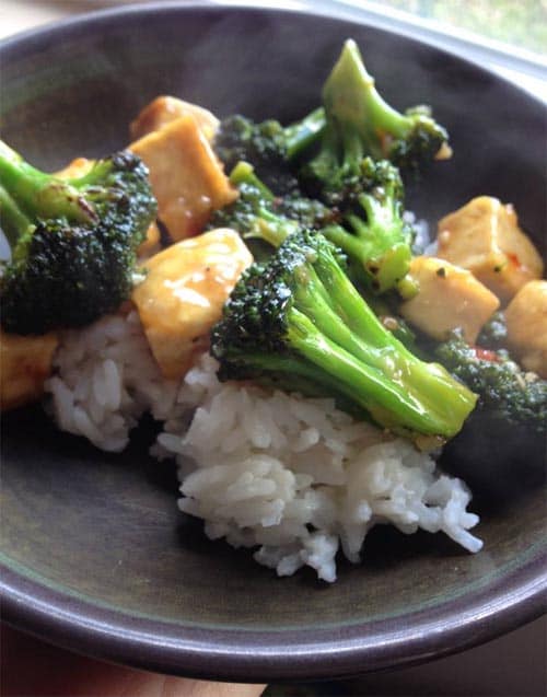 white rice topped with broccoli and chicken