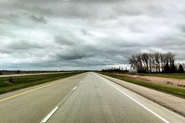 A wide open road with no cars on it. 