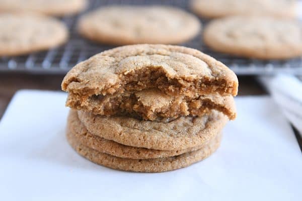 Soft and chewy ginger molasses cookie broken in half.